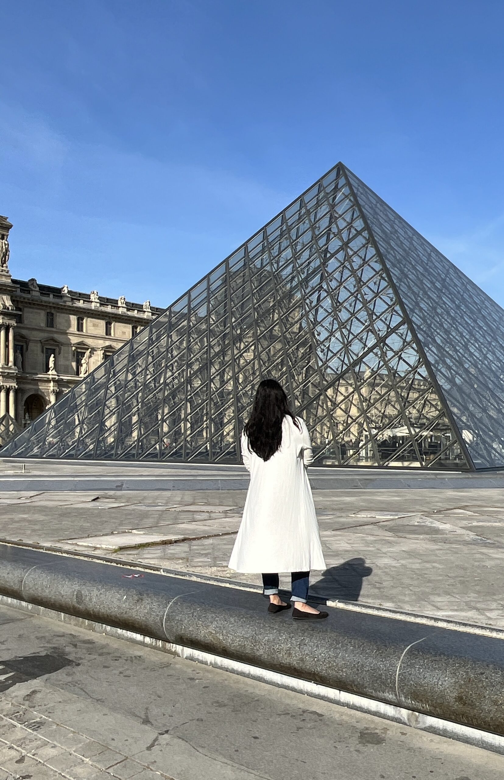 Me looking at the Louvre pyramids